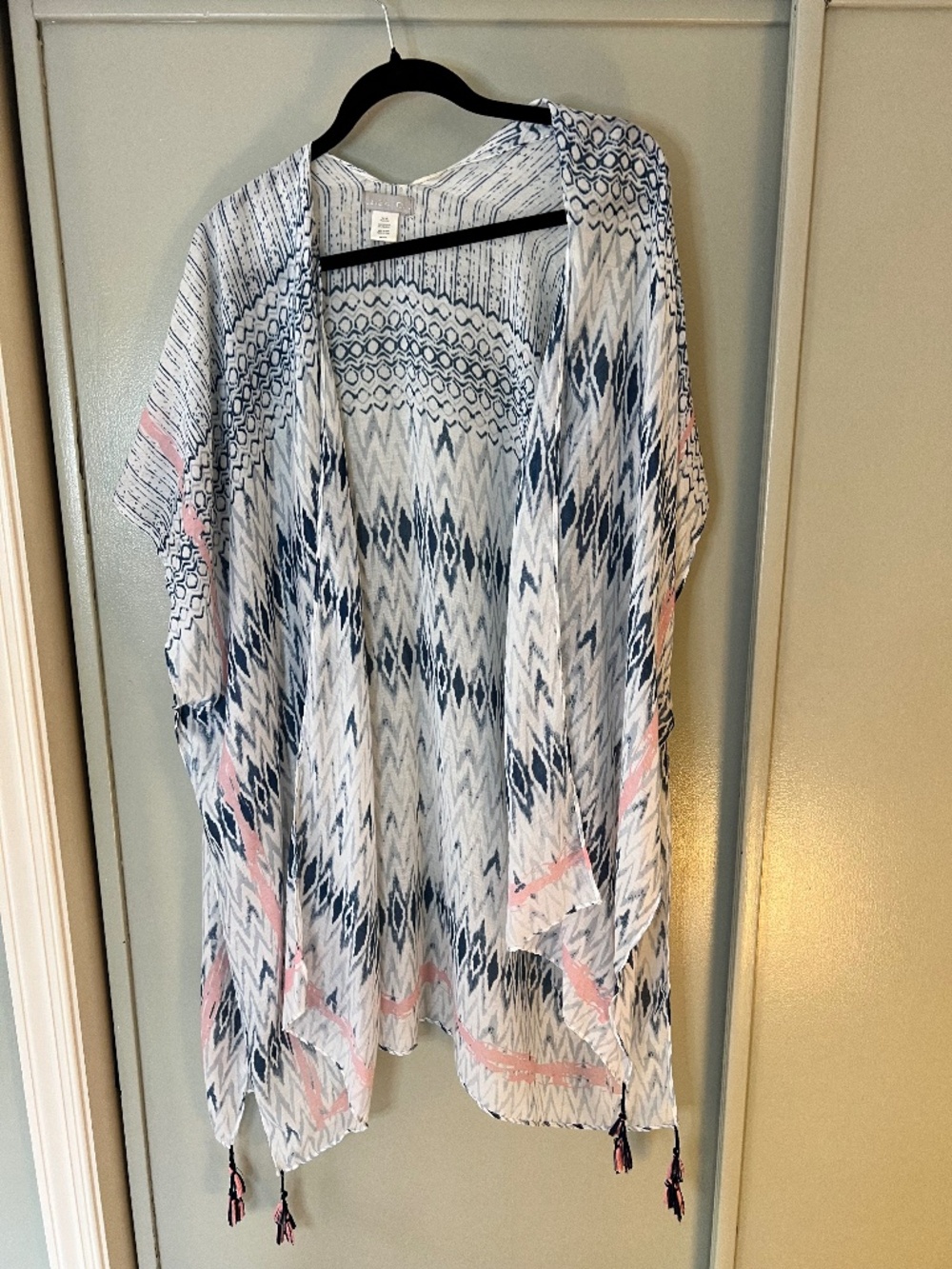 White duster with navy/pink detail